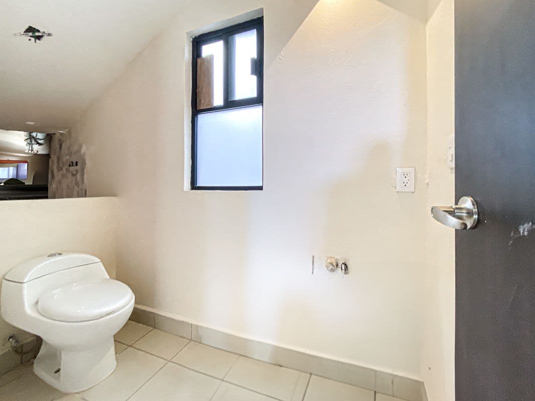 Casa Laura — Las Brisas, San Miguel de Allende — photo 9 — bright, minimalist bathroom with natural light