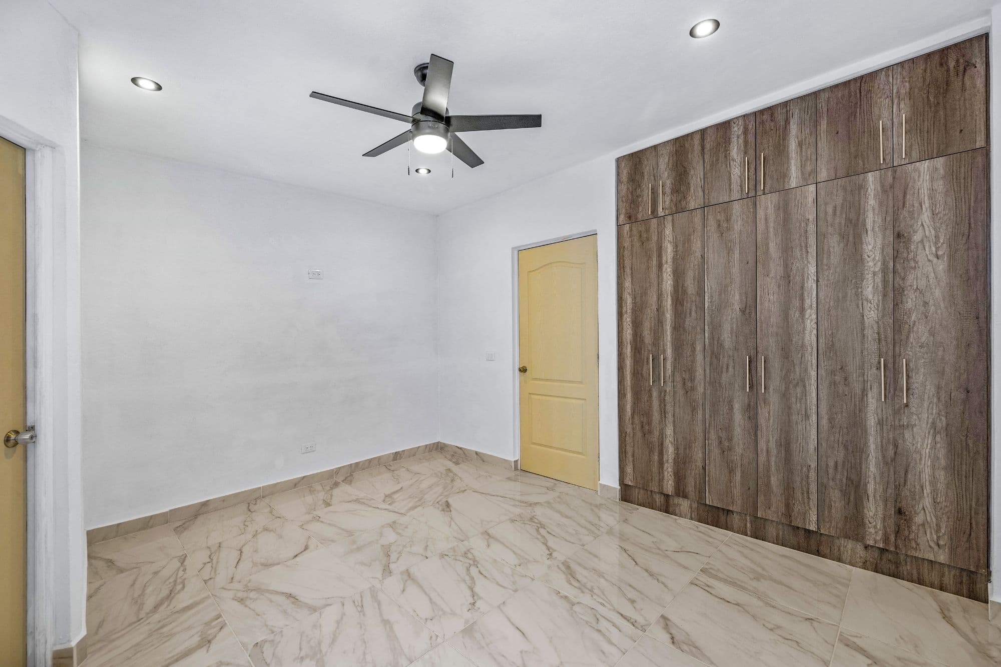 Casa Margarito — Guadalupe, San Miguel de Allende — photo 10 — spacious bedroom with elegant wood cabinetry