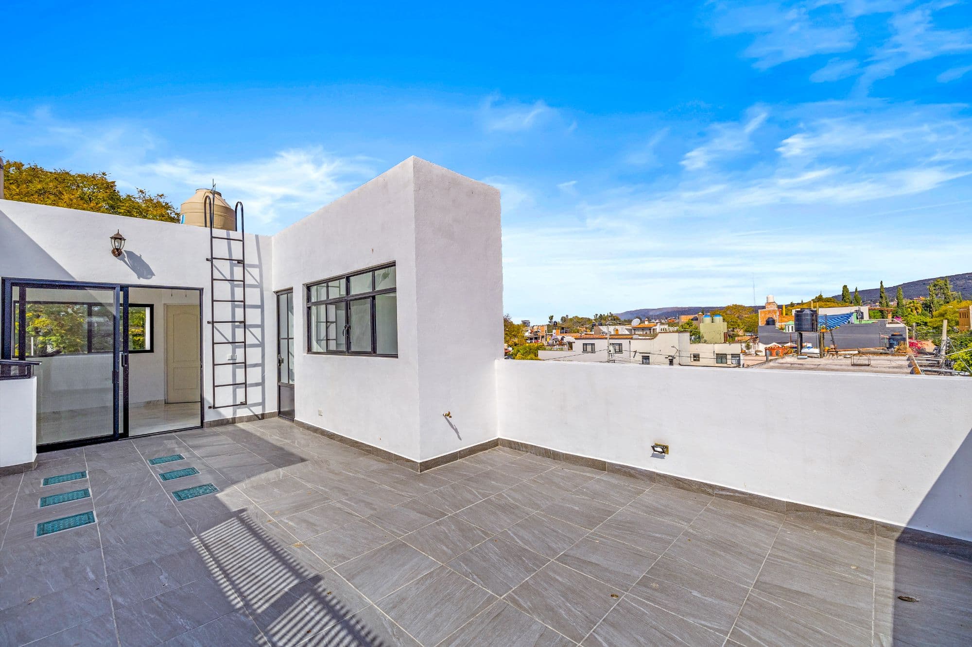 Casa Margarito — Guadalupe, San Miguel de Allende — photo 19 — expansive rooftop terrace, mountain views