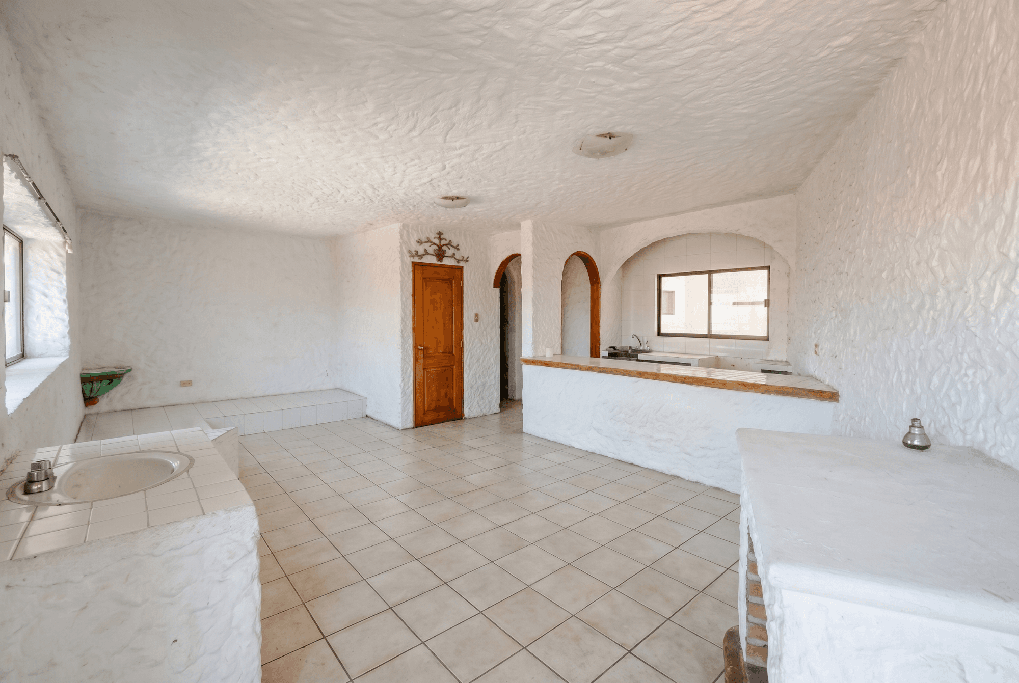Casa Salida a Qro. — San Miguel de Allende Centro, San Miguel de Allende — photo 5 — spacious light-filled kitchen with authentic charm