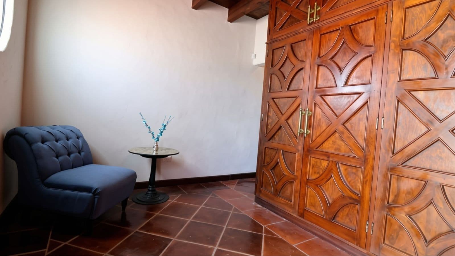 Casa Cocuchas — San Antonio, San Miguel de Allende — photo 22 — elegant bedroom with artisan wooden wardrobe