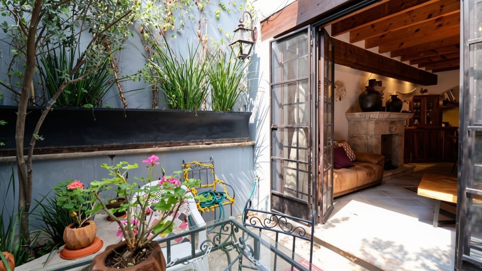 Casa Cocuchas — San Antonio, San Miguel de Allende — photo 9 — sunlit terrace opens to charming bedroom