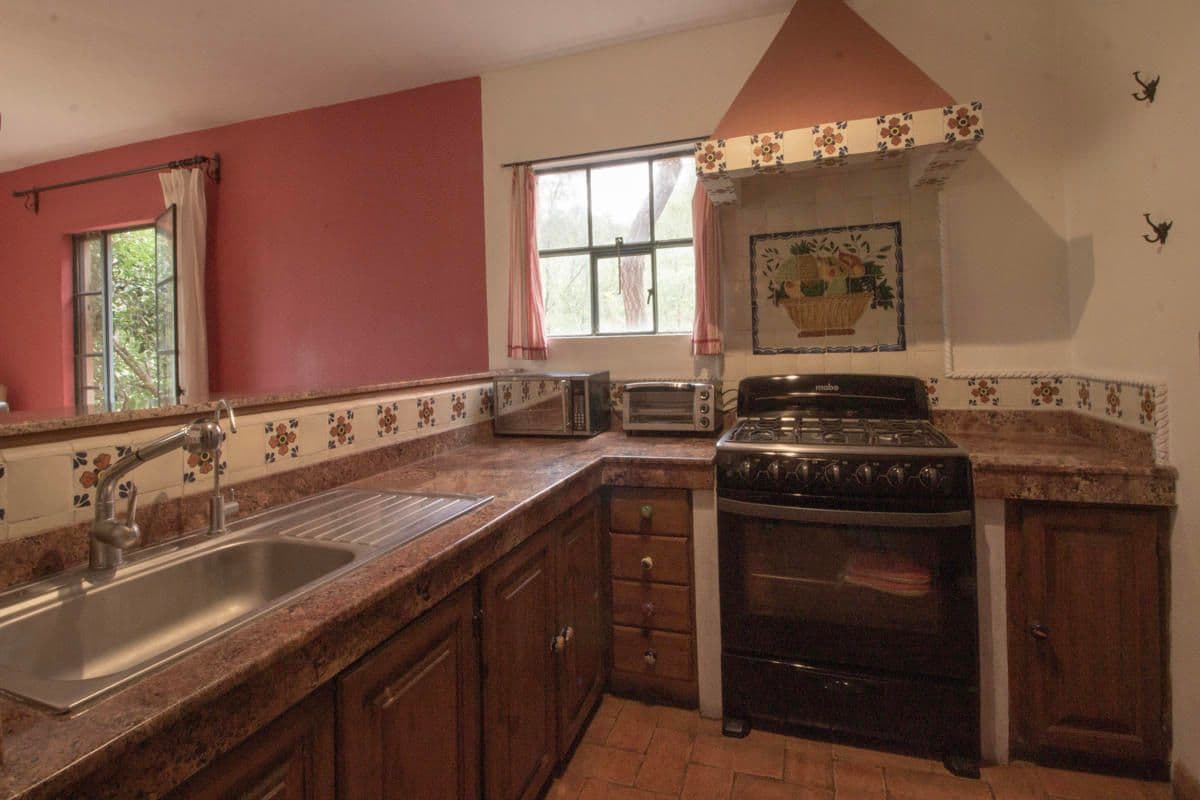 Condo for Sale in Santo Domingo, Atascadero — Centro, San Miguel de Allende — photo 11 — charming traditional kitchen, rustic elegance