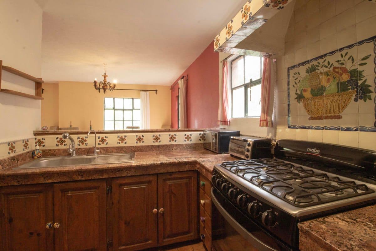Condo for Sale in Santo Domingo, Atascadero — Centro, San Miguel de Allende — photo 10 — charming traditional mexican kitchen, sun-drenched