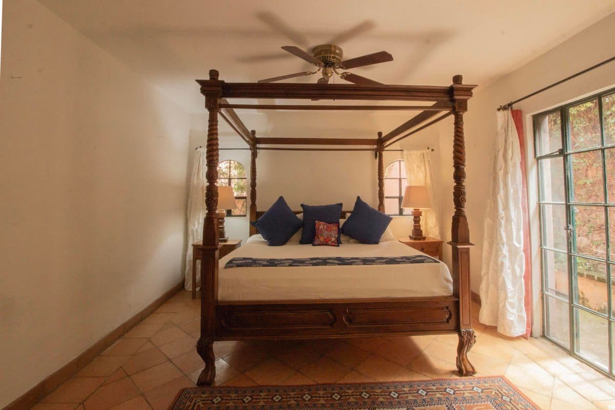 Condo for Sale in Santo Domingo, Atascadero — Centro, San Miguel de Allende — photo 25 — sunlit bedroom, carved colonial elegance