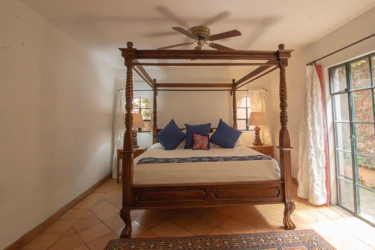 Condo for Sale in Santo Domingo, Atascadero — Centro, San Miguel de Allende — photo 26 — charming colonial bedroom, elegant wooden canopy