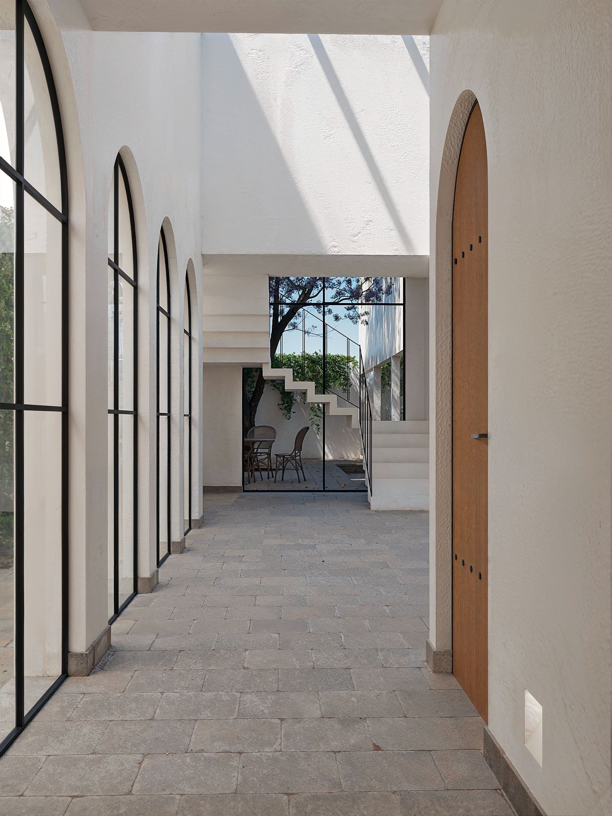 ALVA Lot 2 — El Obraje, San Miguel de Allende — photo 8 — sunlit arched corridor, elegant architectural details