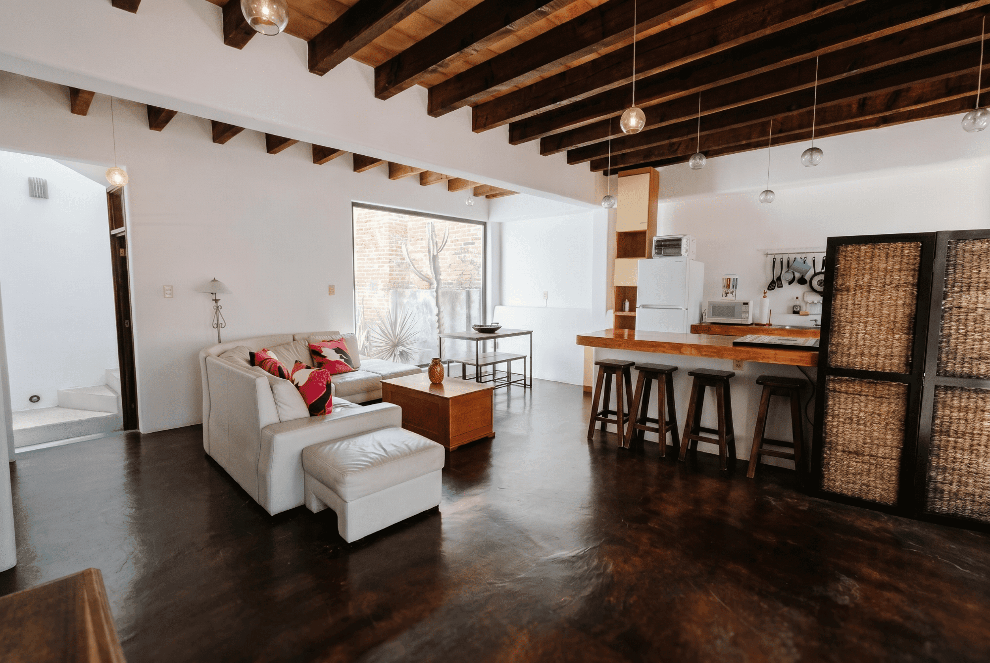 Casa Toro — San Miguel de Allende Centro, San Miguel de Allende — photo 6 — open-concept living with soaring beamed ceilings