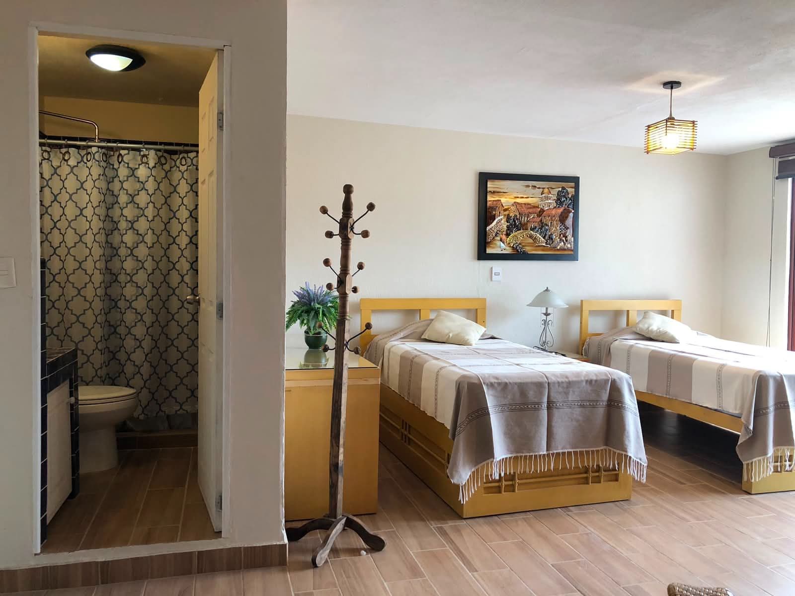 Casa Vista Carolina — Lindavista, San Miguel de Allende — photo 2 — spacious guest quarters, warm golden accents
