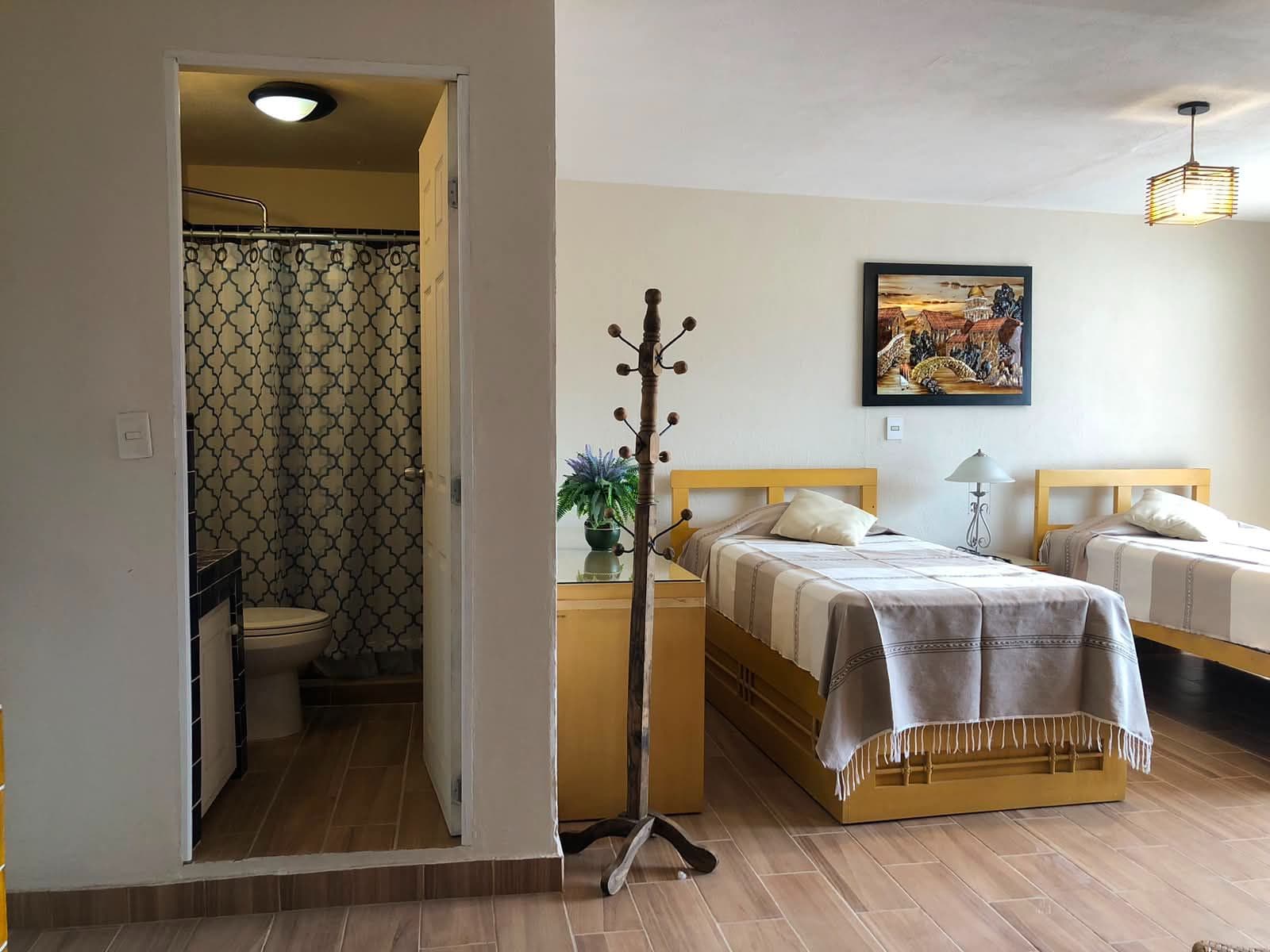 Casa Vista Carolina — Lindavista, San Miguel de Allende — photo 5 — bright dual bedroom suite, ensuite bath
