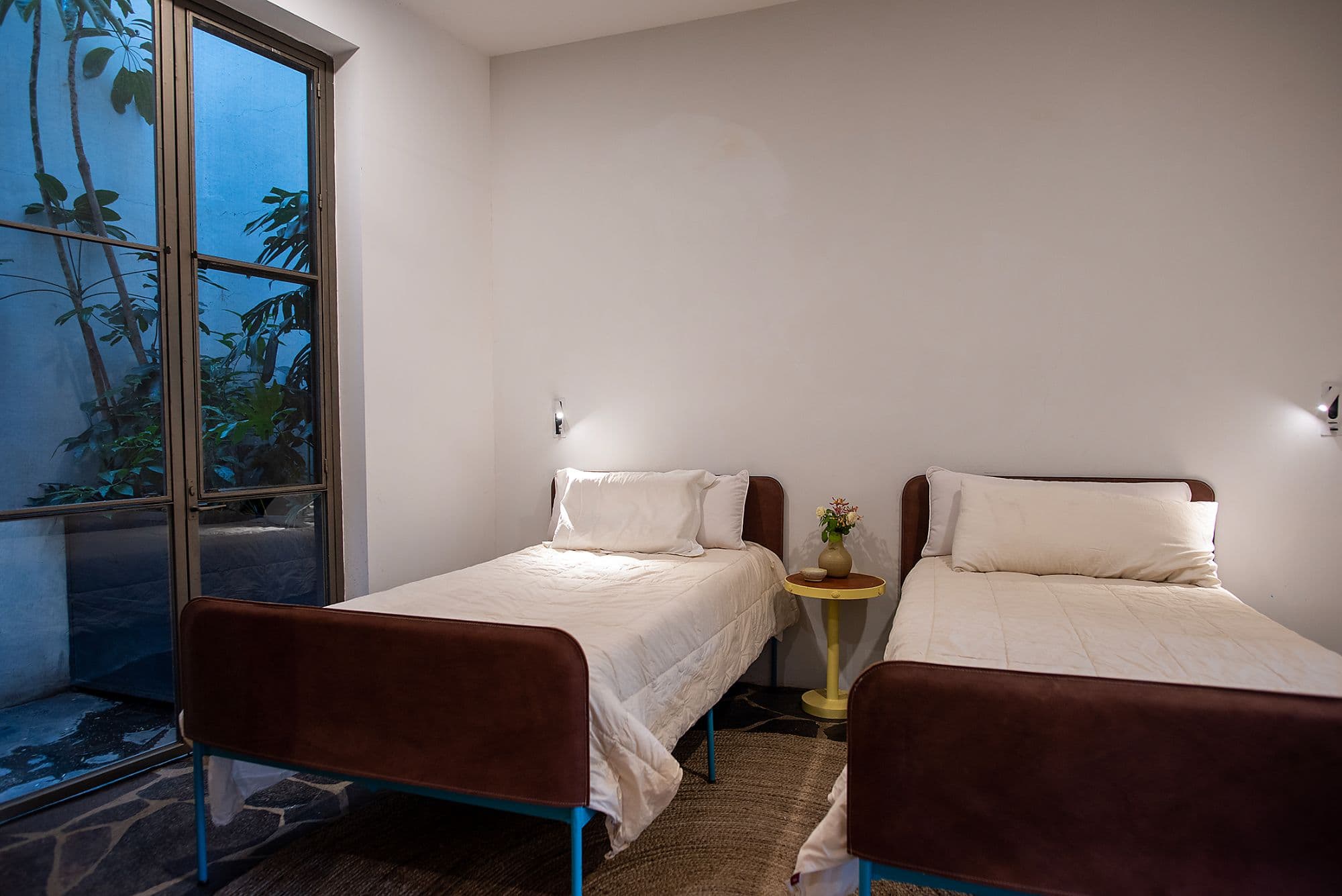 CASA CLARA — Centro, San Miguel de Allende — photo 15 — serene twin bedroom with garden views