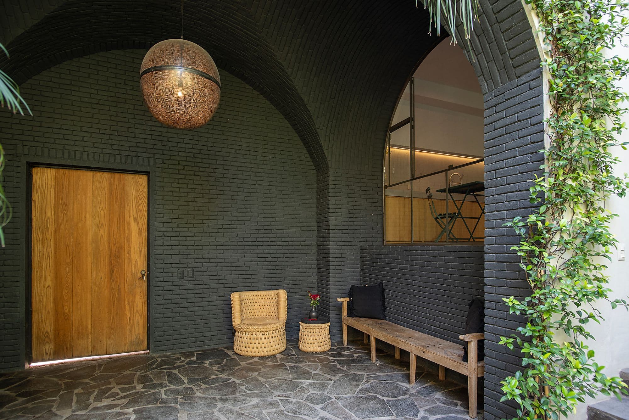 CASA CLARA — Centro, San Miguel de Allende — photo 2 — arched brick courtyard with ambient warmth