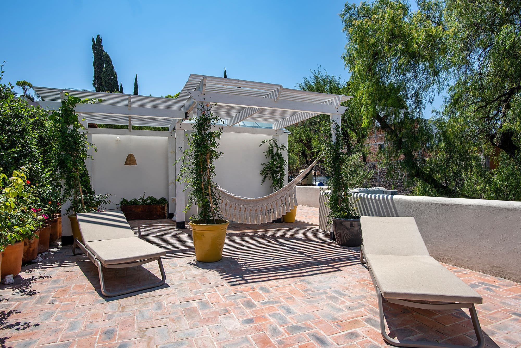 CASA CLARA — Centro, San Miguel de Allende — photo 18 — sunlit rooftop oasis with pergola shade