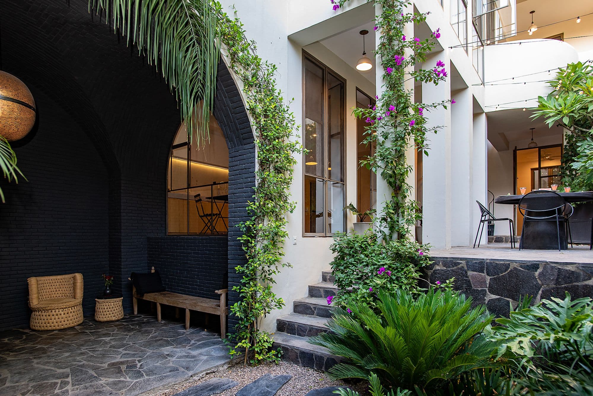 CASA CLARA — Centro, San Miguel de Allende — photo 19 — verdant courtyard, architectural elegance
