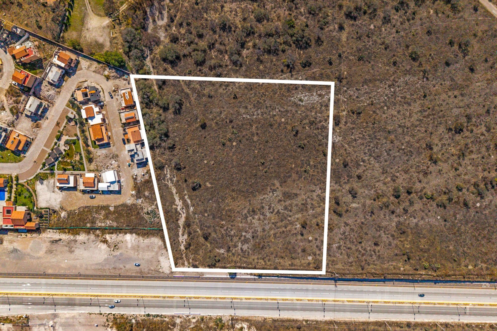El Cortijo Lot — El Cortijo, San Miguel de Allende — photo 5 — expansive raw land, prime highway frontage