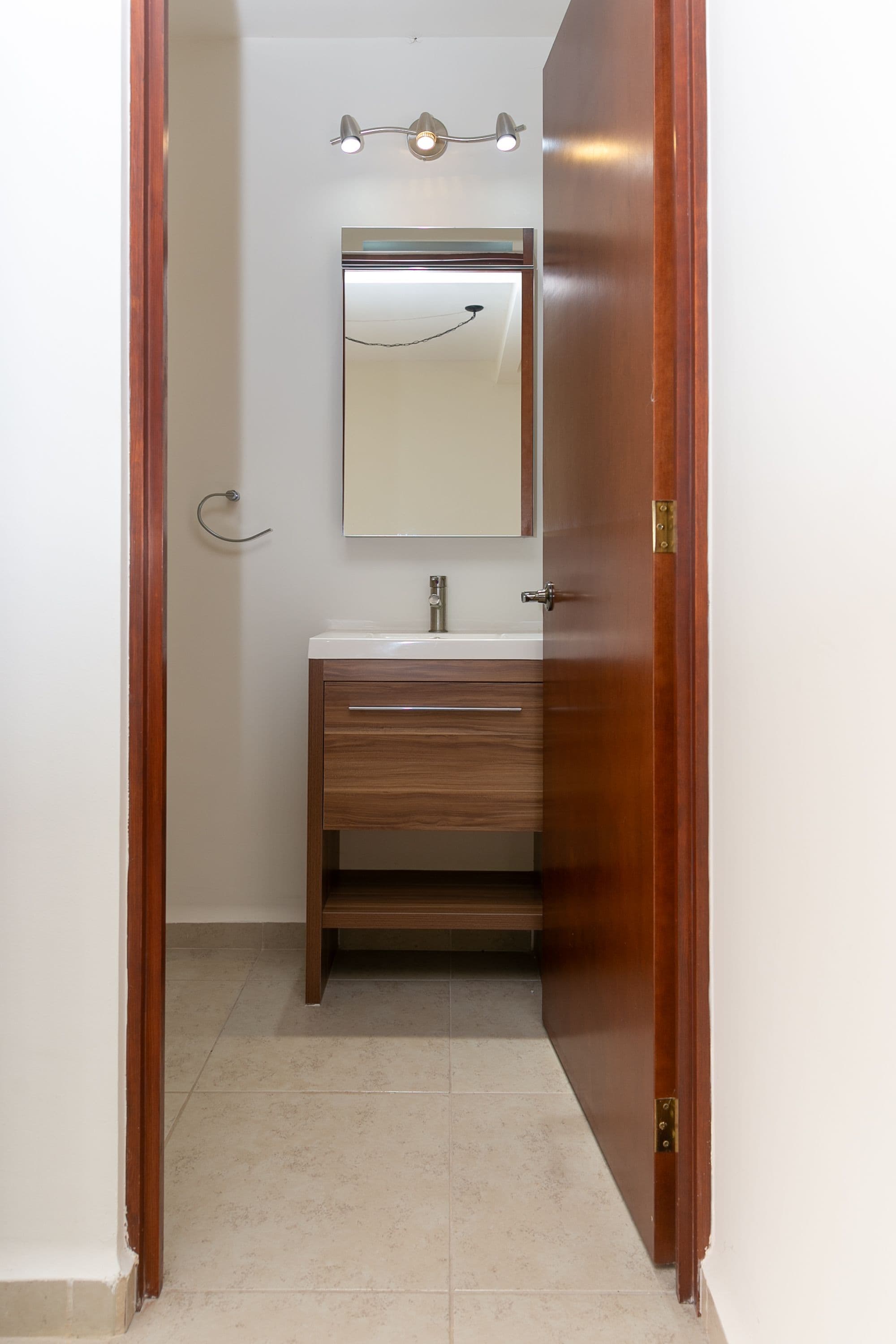 Casa Circuito El Reloj — Zirándaro, San Miguel de Allende — photo 25 — elegant modern vanity with warm lighting