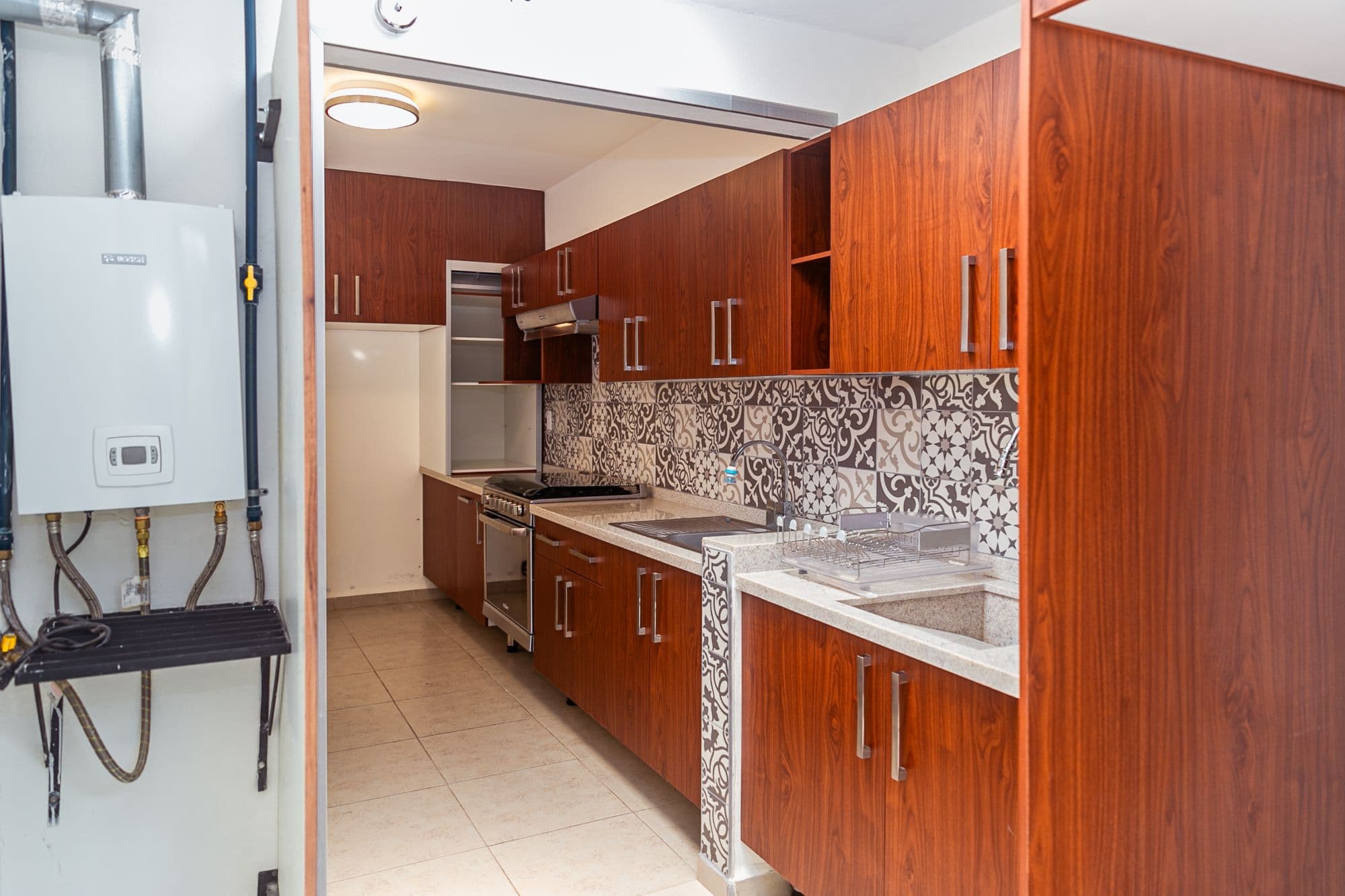 Casa Circuito El Reloj — Zirándaro, San Miguel de Allende — photo 12 — contemporary kitchen, rich wood elegance