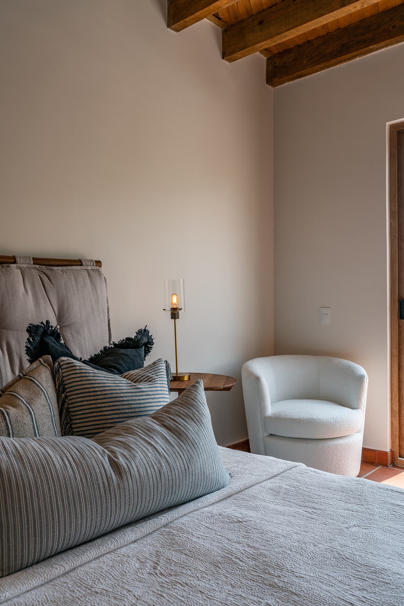 Recreo 70 — Centro, San Miguel de Allende — photo 11 — serene bedroom with rustic wooden beams