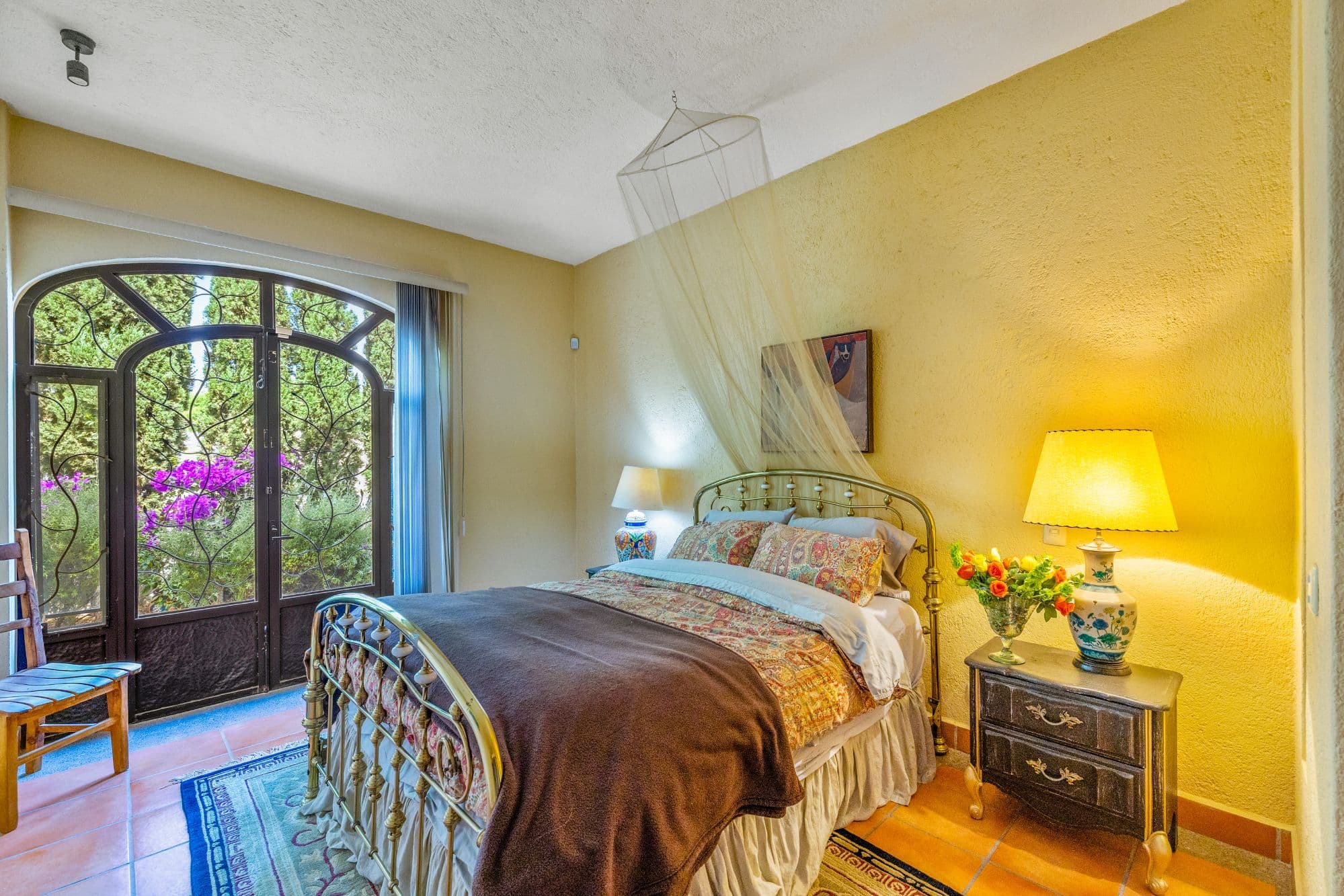 Casa Jardin Secreto — Los Labradores, San Miguel de Allende — photo 13 — sunlit bedroom with garden views