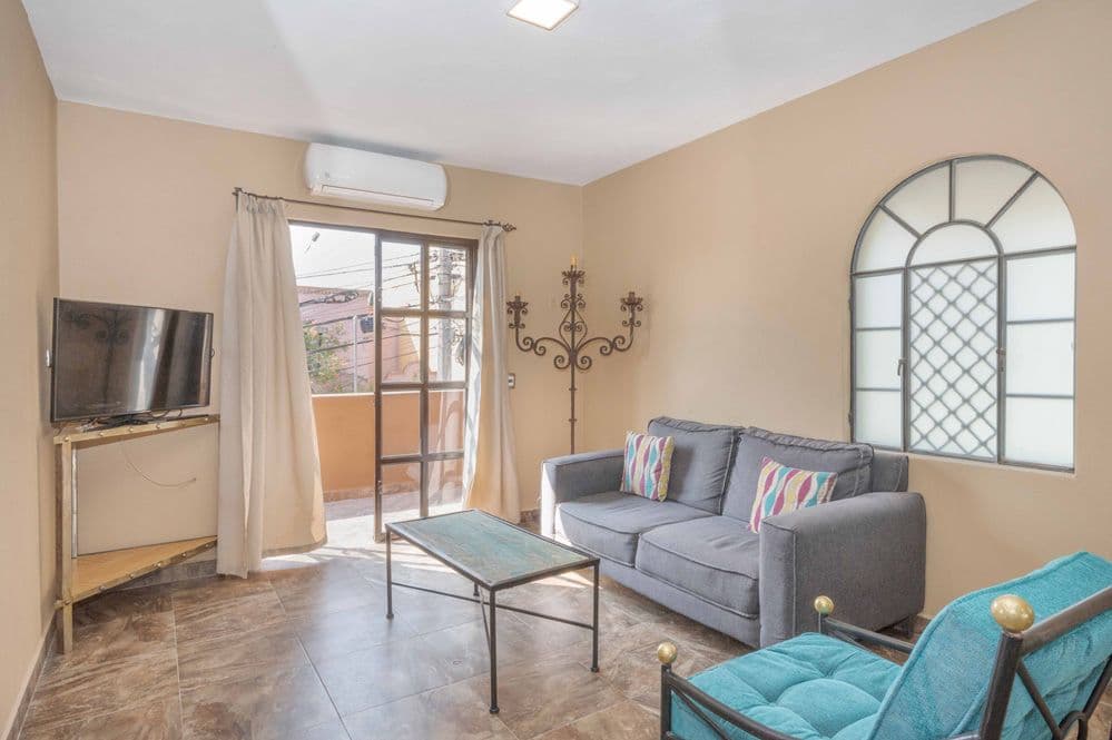 Duplex Fray Bartolome — Independencia, San Miguel de Allende — photo 5 — radiant sunlit living with terrace views