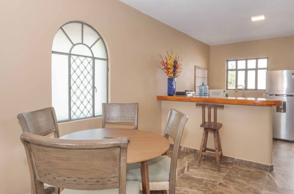 Duplex Fray Bartolome — Independencia, San Miguel de Allende — photo 4 — luminous dining space, rustic elegance