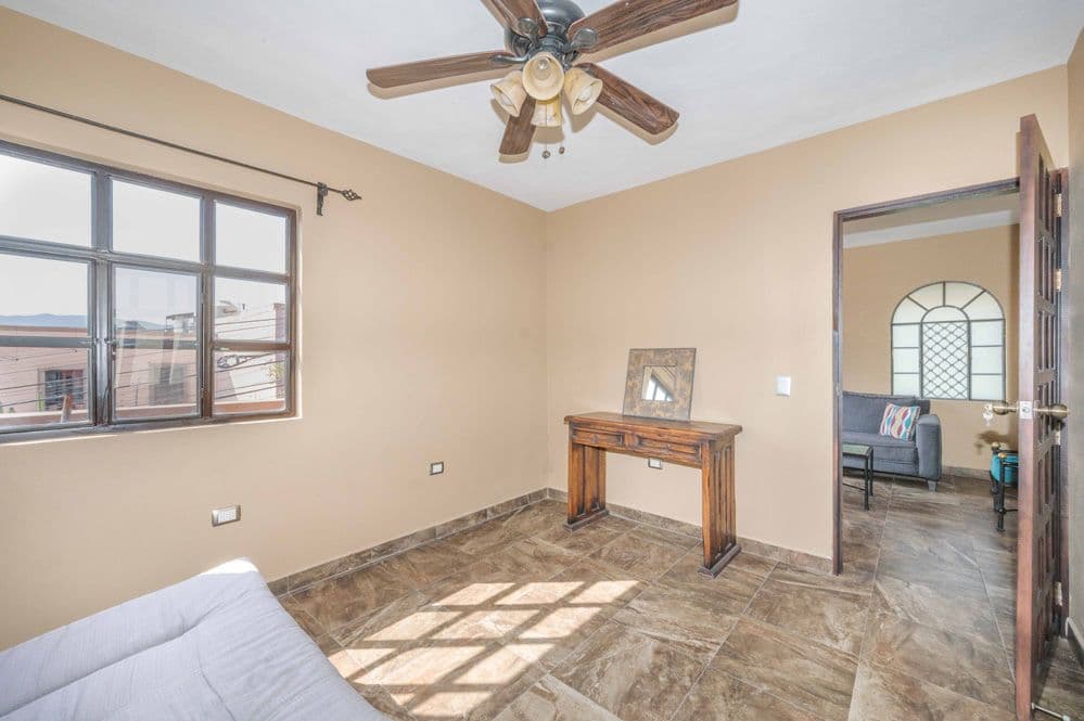 Duplex Fray Bartolome — Independencia, San Miguel de Allende — photo 8 — sun-drenched bedroom with panoramic views