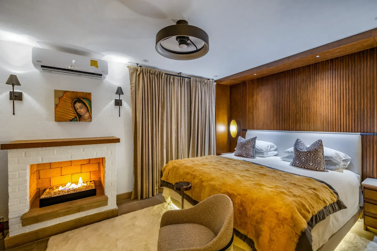 Casa Romana — Centro, San Miguel de Allende — photo 17 — luxe master suite, warmth ablaze