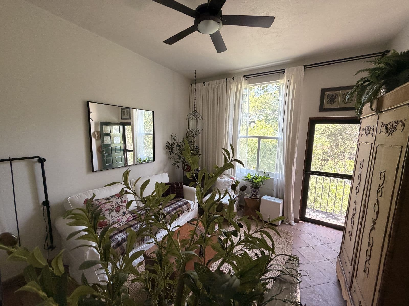 Molly Mellor — Centro, San Miguel de Allende — photo 10 — bright, plant-filled bedroom with garden views