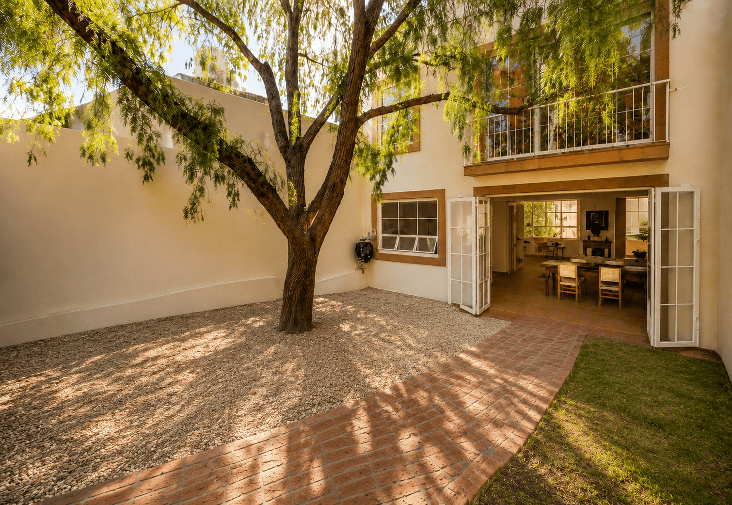 CASA BALCÓN A LA PARROQUIA — Lindavista, San Miguel de Allende — photo 2 — mature courtyard with dappled sunlight