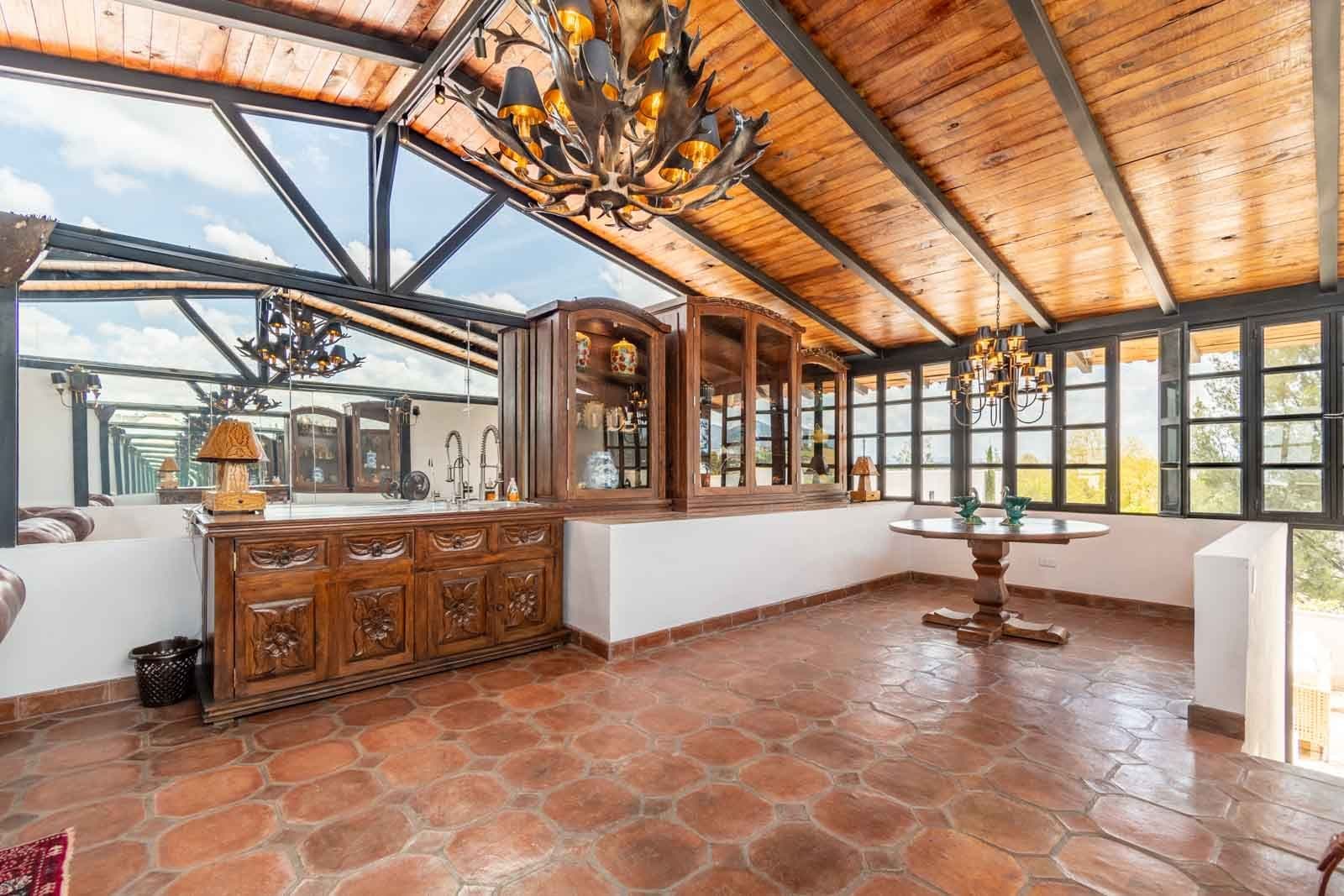 Casa Blanca — Centro, San Miguel de Allende — photo 20 — luminous glass conservatory, soaring wooden beams