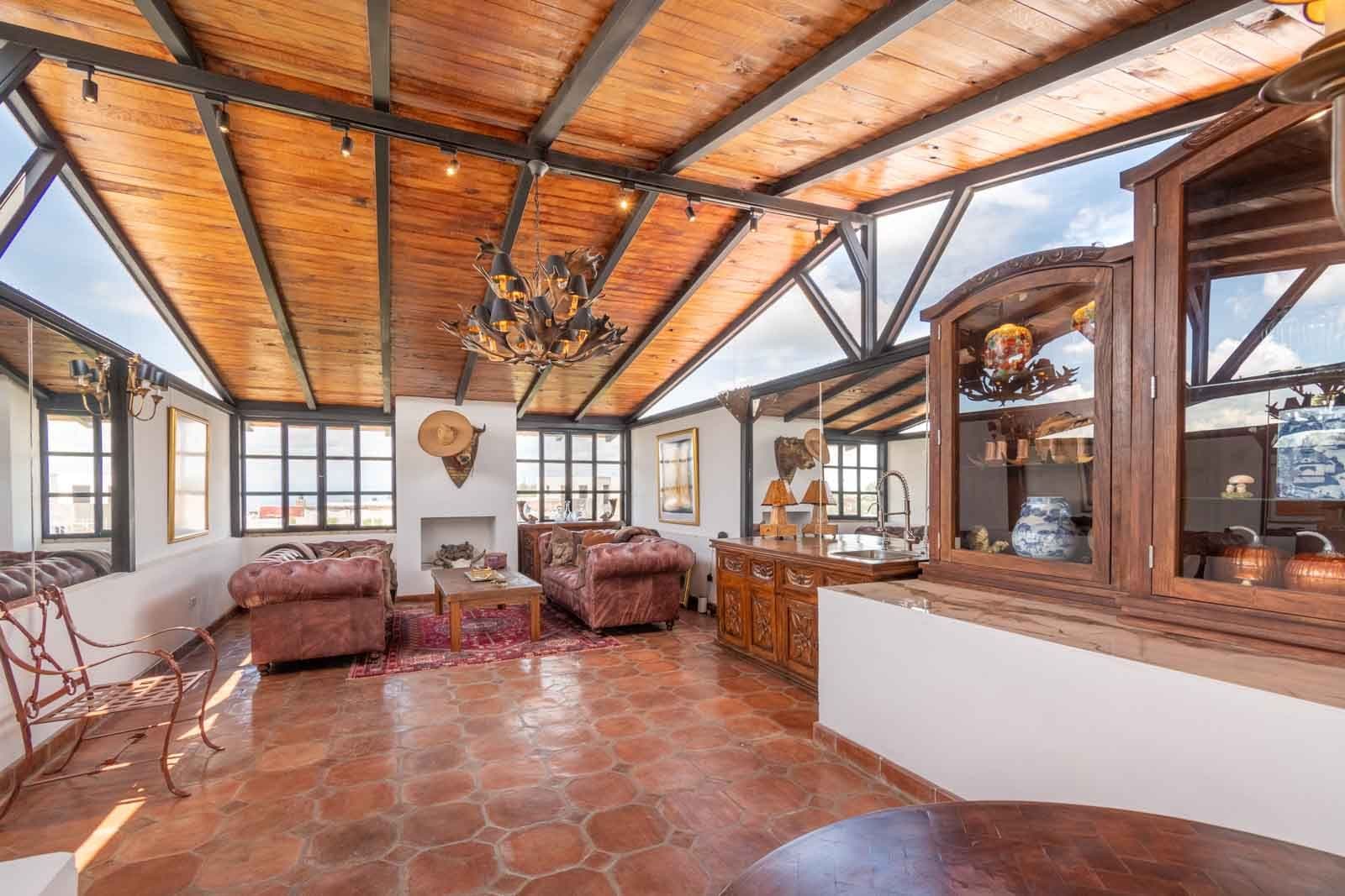 Casa Blanca — Centro, San Miguel de Allende — photo 21 — sun-drenched gallery with soaring timber beams