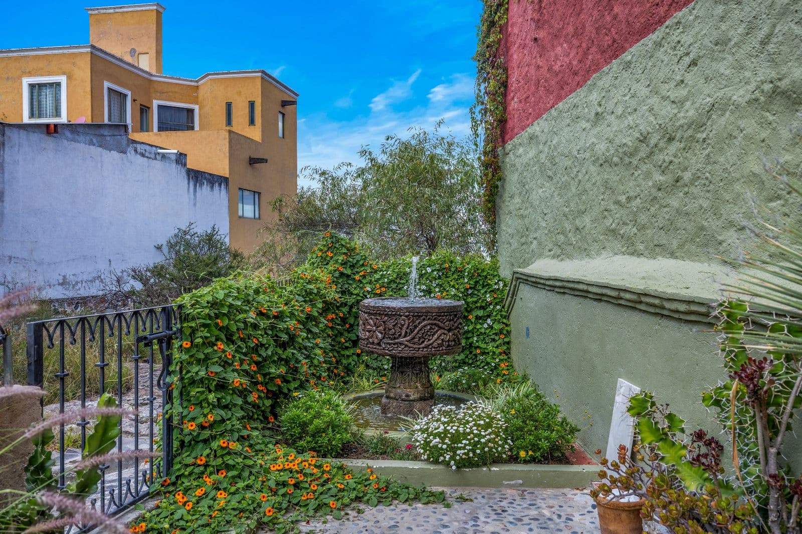 Casa Montitlan — Balcones, San Miguel de Allende — photo 7 — charming courtyard, vibrant blooms, colonial elegance