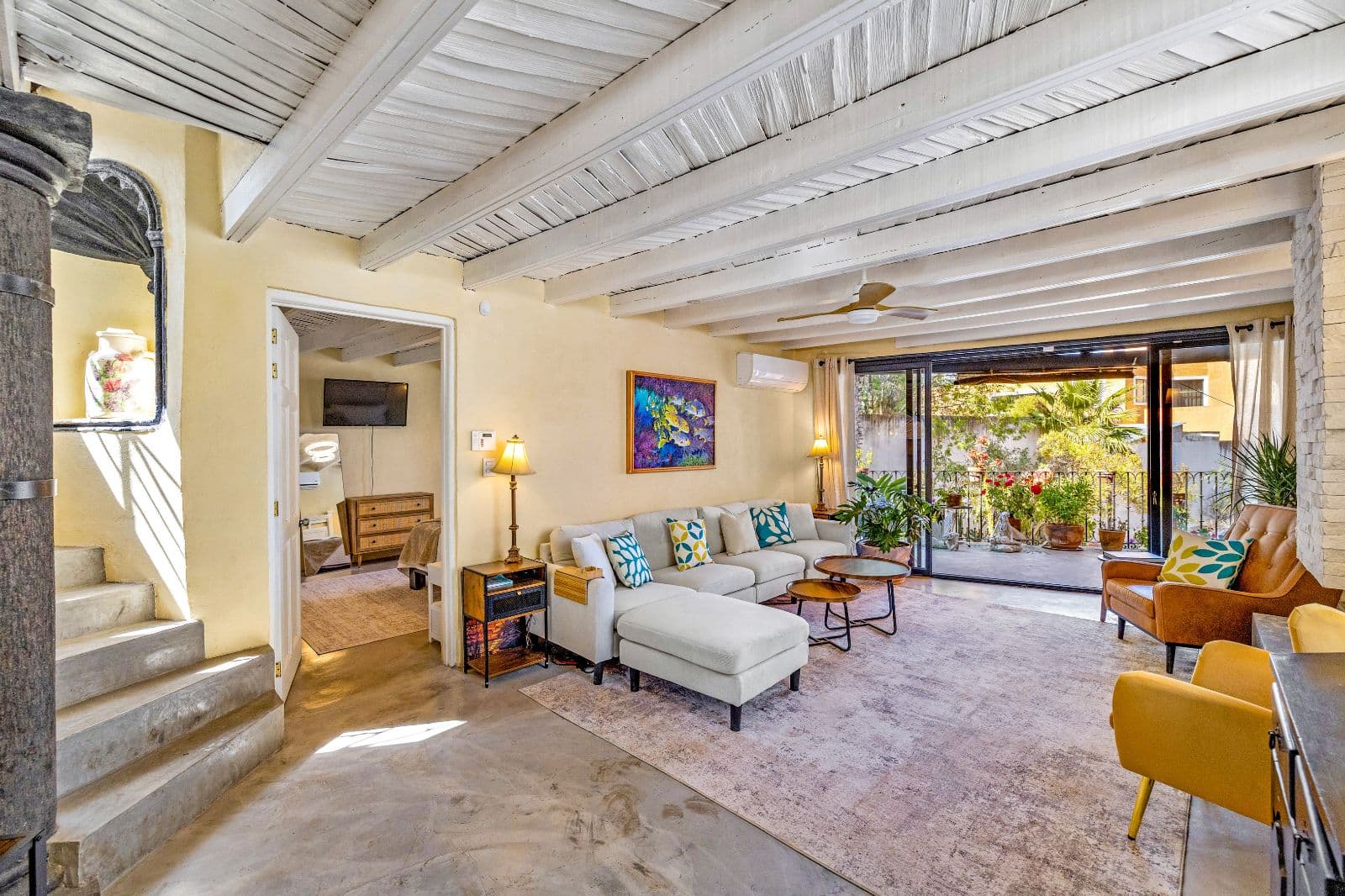 Casa Montitlan — Balcones, San Miguel de Allende — photo 14 — sunlit living space, vibrant garden views