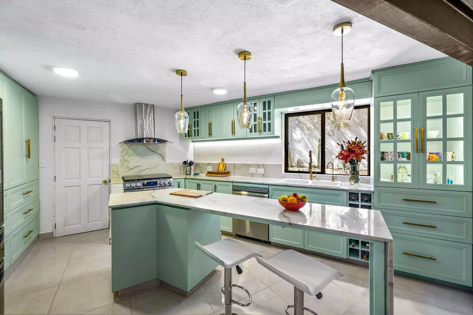 Casa Montitlan — Balcones, San Miguel de Allende — photo 5 — sophisticated sage kitchen, radiant natural light