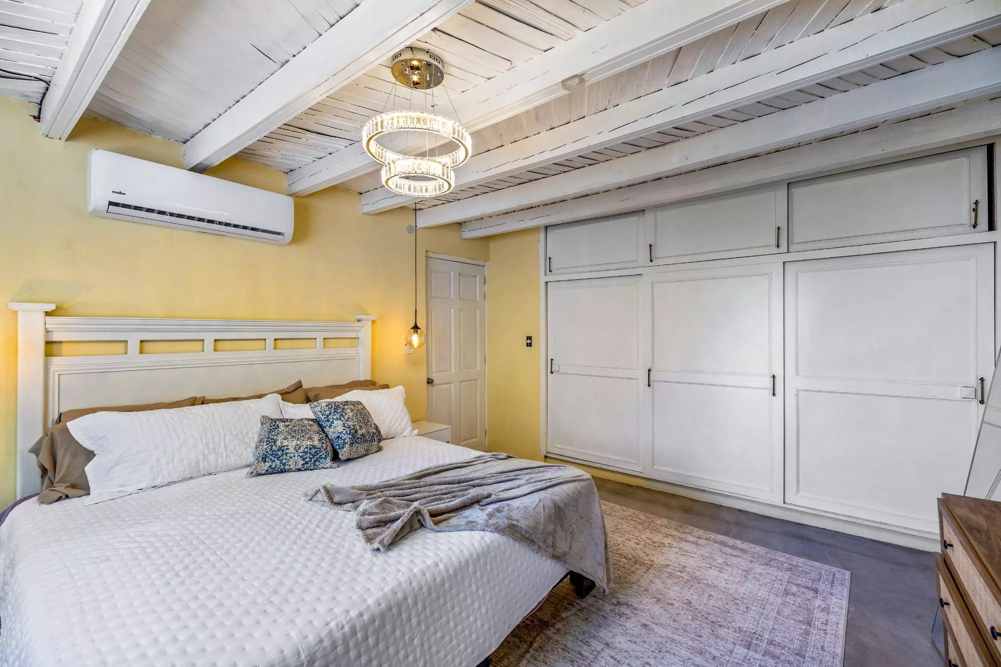 Casa Montitlan — Balcones, San Miguel de Allende — photo 22 — luminous primary suite, architectural beams elegantly