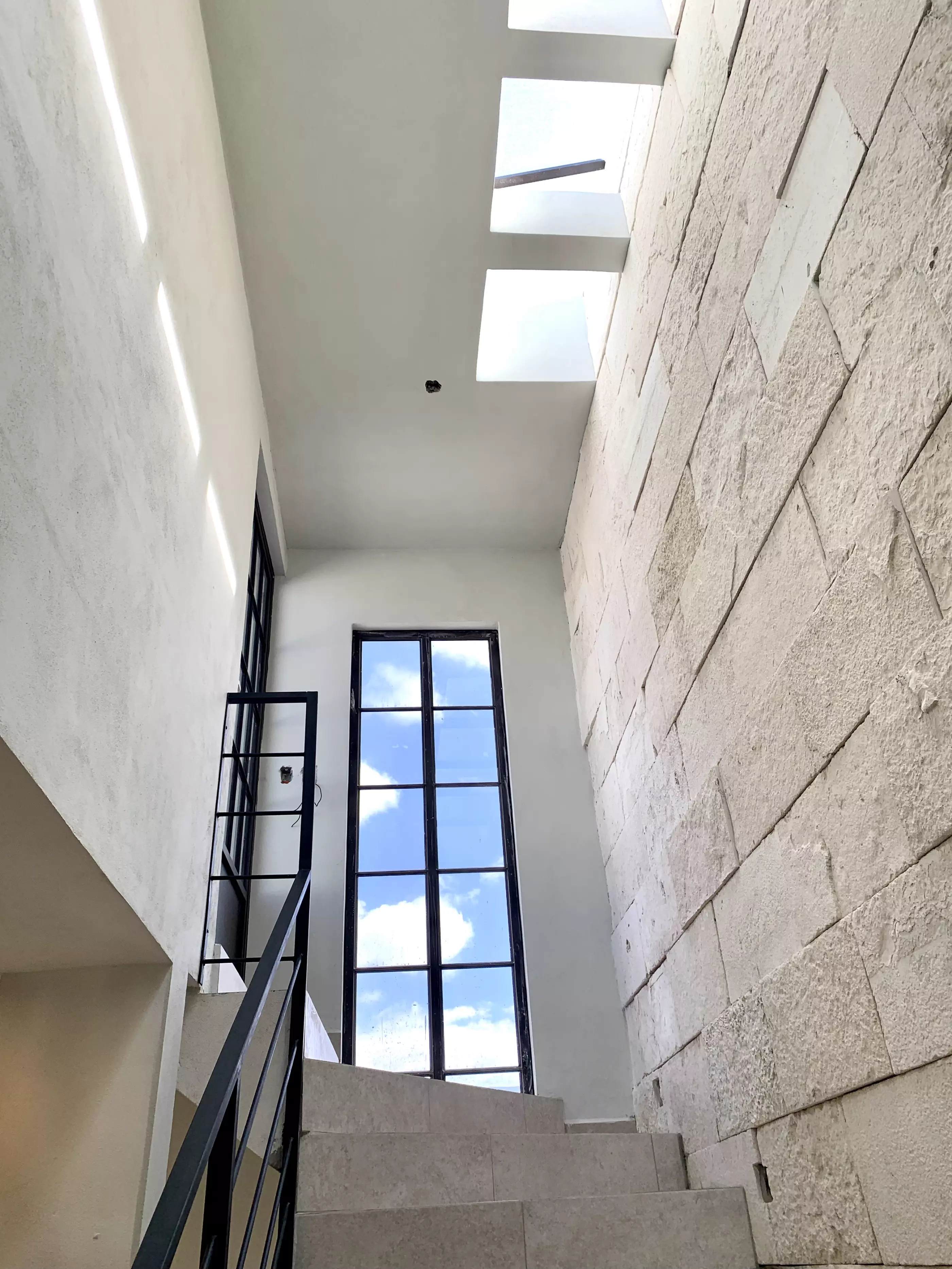 Casa San Carlos — San Rafael, San Miguel de Allende — photo 11 — soaring double-height stairwell, abundant natural light