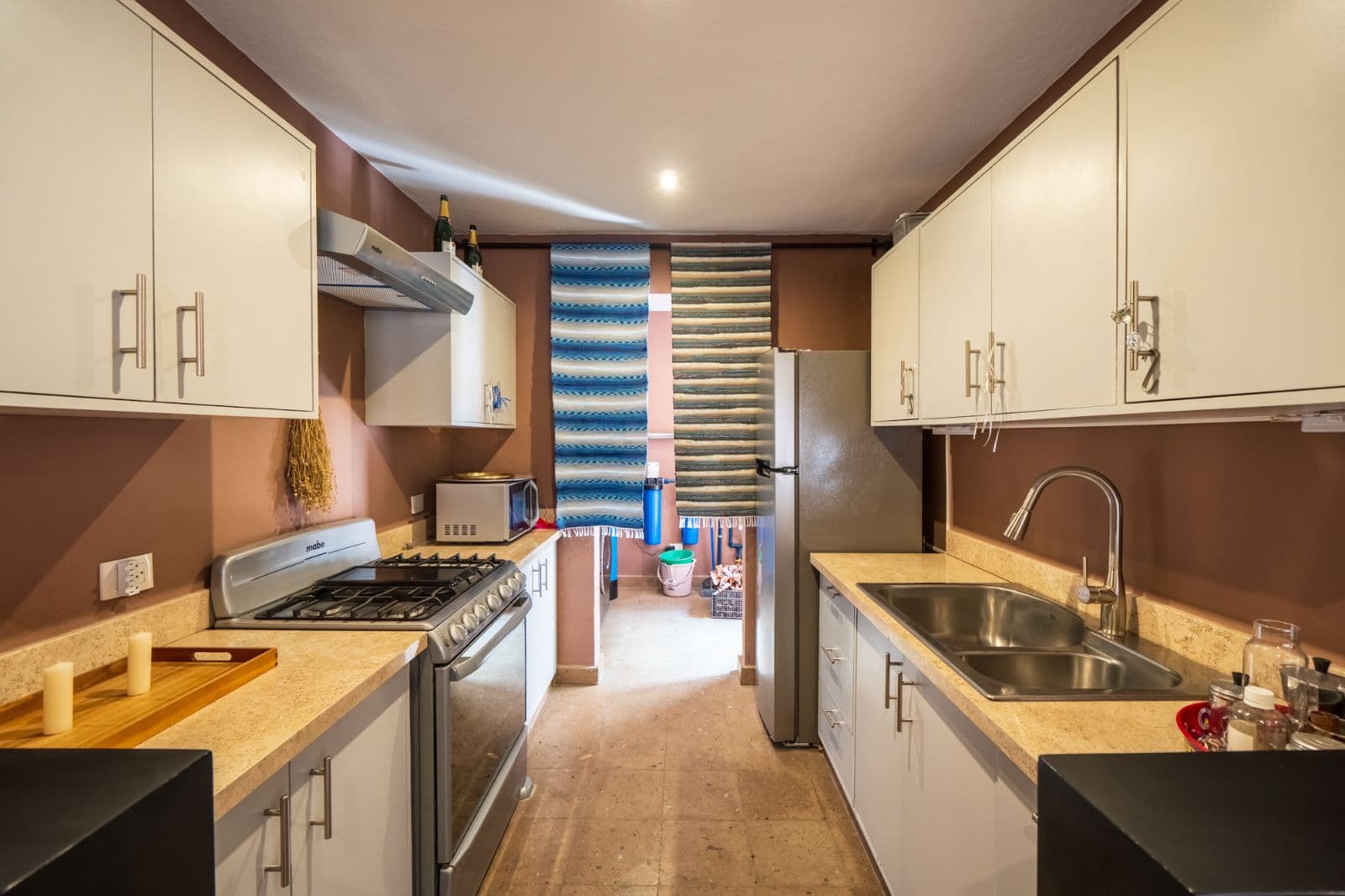 Casa Cielito Lindo — Guadalupe, San Miguel de Allende — photo 5 — contemporary galley kitchen, tastefully appointed