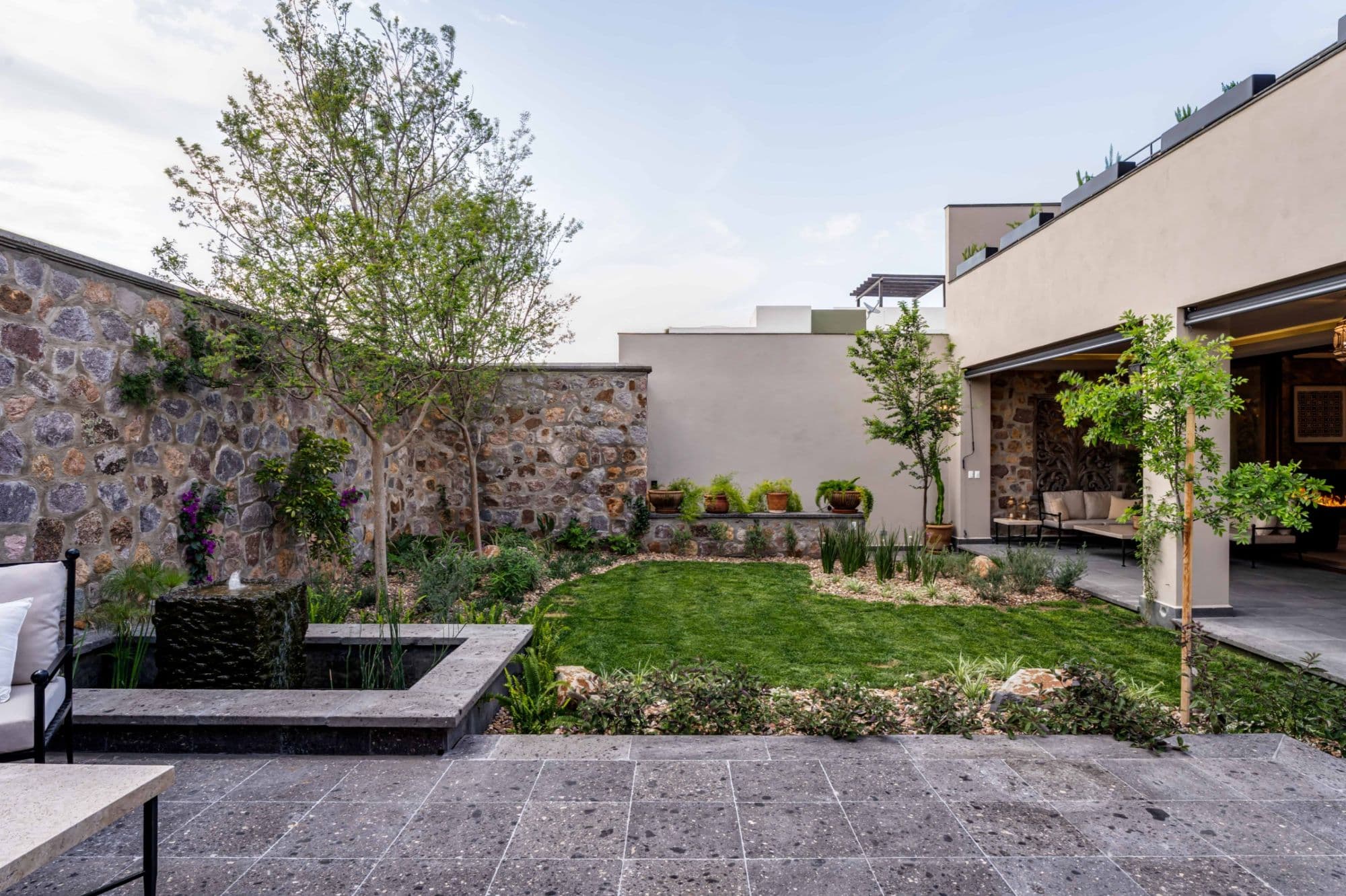 Casa Paulena — Balcones, San Miguel de Allende — photo 37 — serene courtyard with native stonework elegance