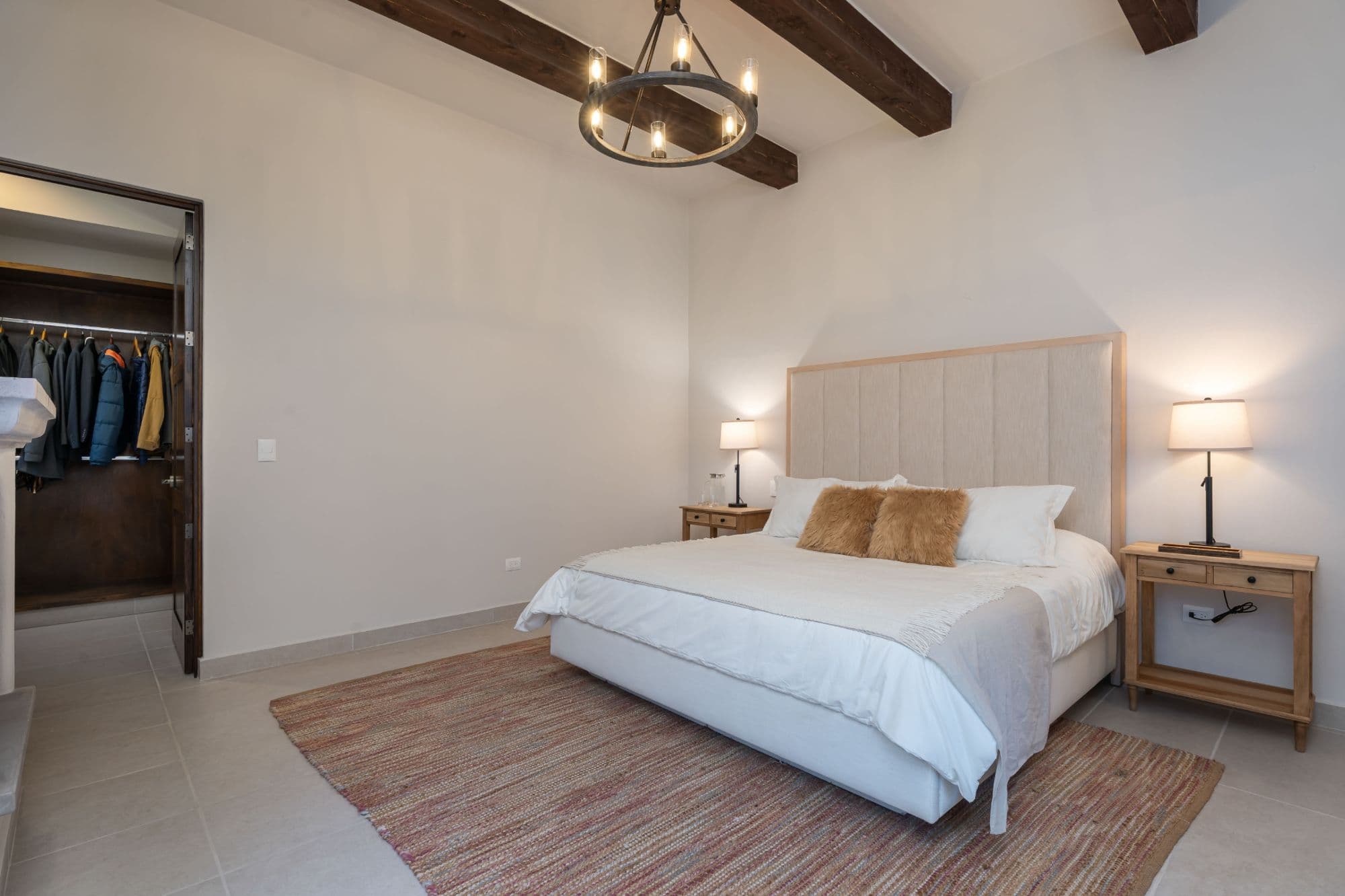 Casa Paulena — Balcones, San Miguel de Allende — photo 13 — serene primary suite, exposed beams, refined elegance