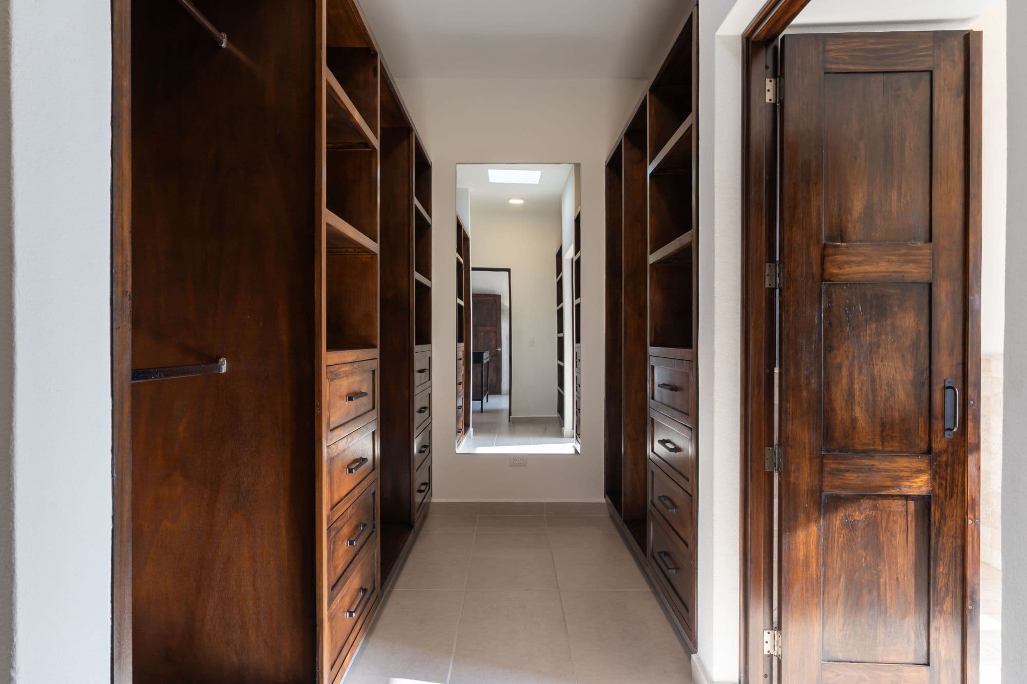 Casa Paulena — Balcones, San Miguel de Allende — photo 28 — elegant walk-in closet, rich wood craftsmanship