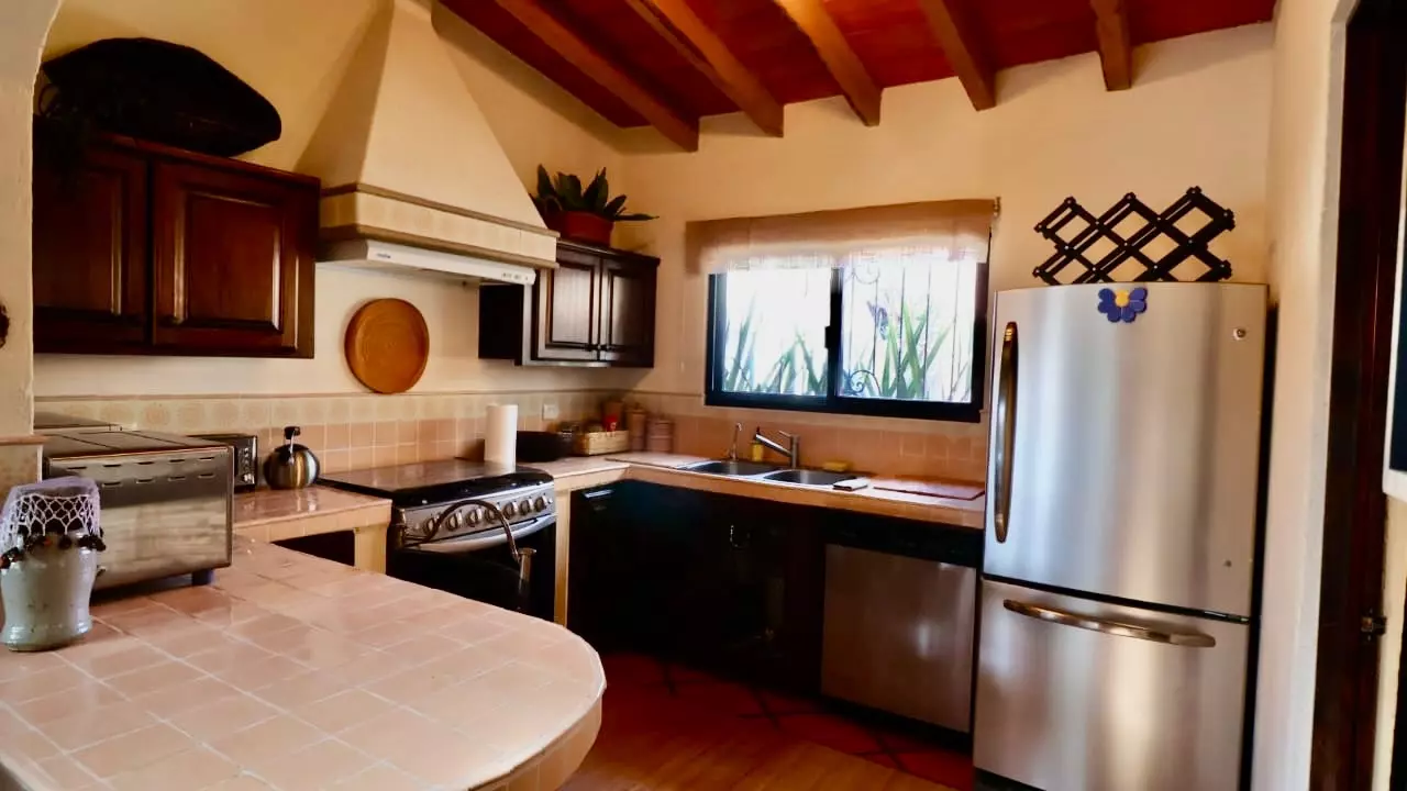 Casa Fortuna — Los Labradores, San Miguel de Allende — photo 6 — rustic-elegant kitchen with exposed beams