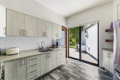 Casa Pial — Centro, San Miguel de Allende — photo 6 — contemporary kitchen opens to verdant gardens