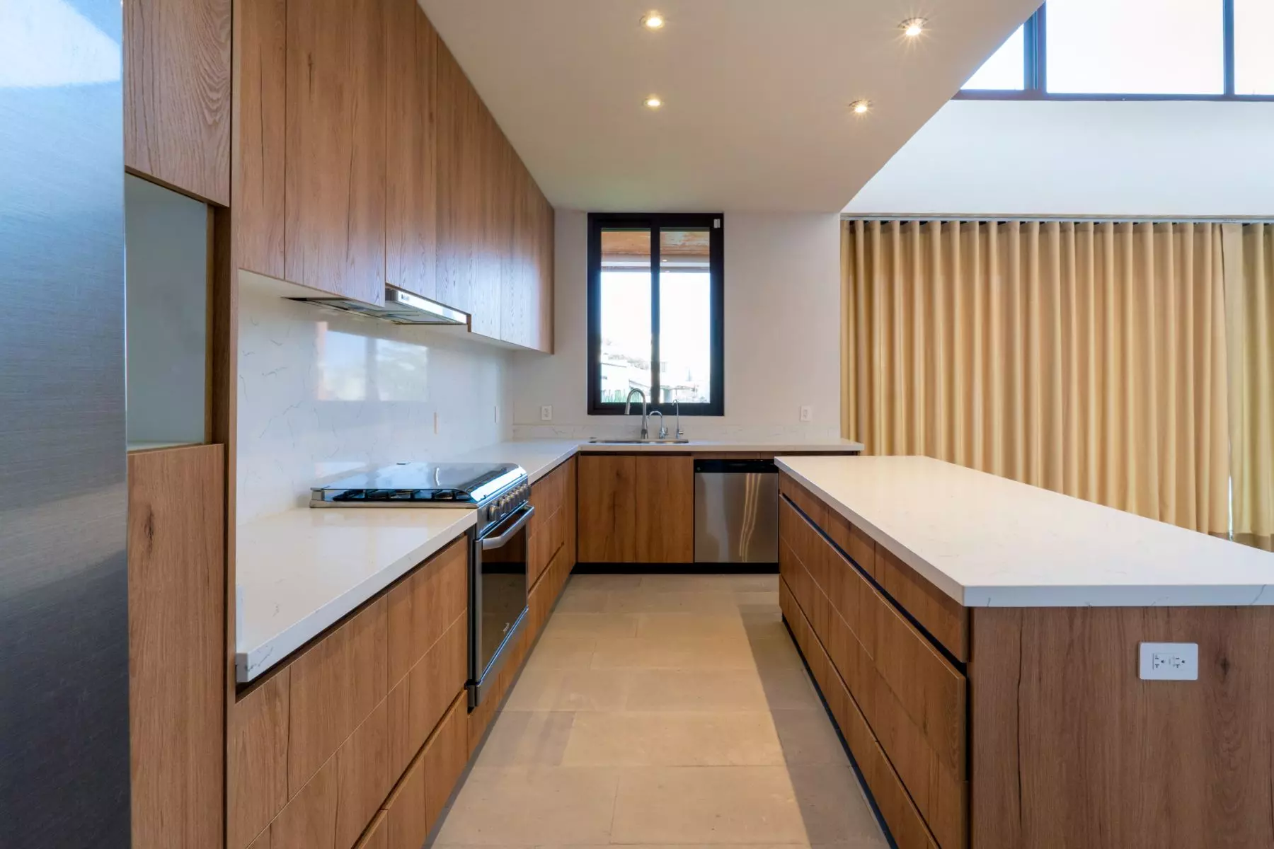 Casa Soñada — Zirándaro, San Miguel de Allende — photo 22 — contemporary chef's kitchen with abundant natural light