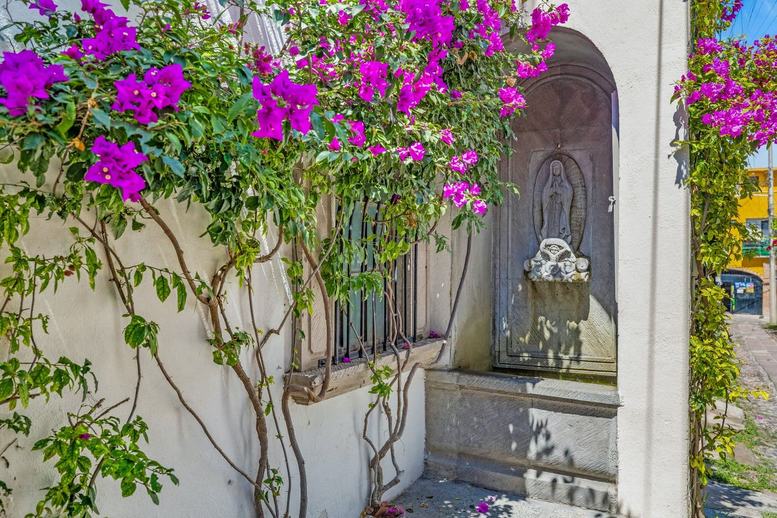 Casa Clae — Guadiana, San Miguel de Allende — photo 8 — vibrant bougainvillea frames sacred entrance