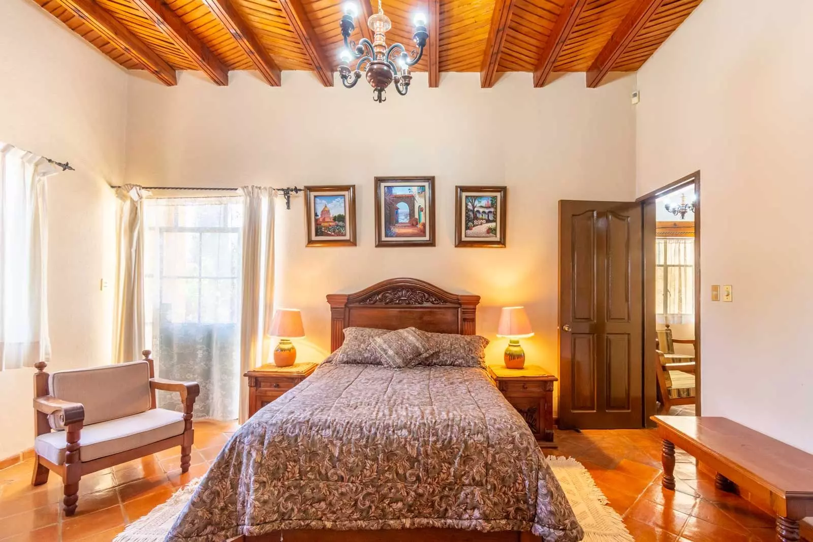 Agua Homes — Atascadero (Arcos de San Miguel), San Miguel de Allende — photo 9 — elegant master suite, soaring wooden beams