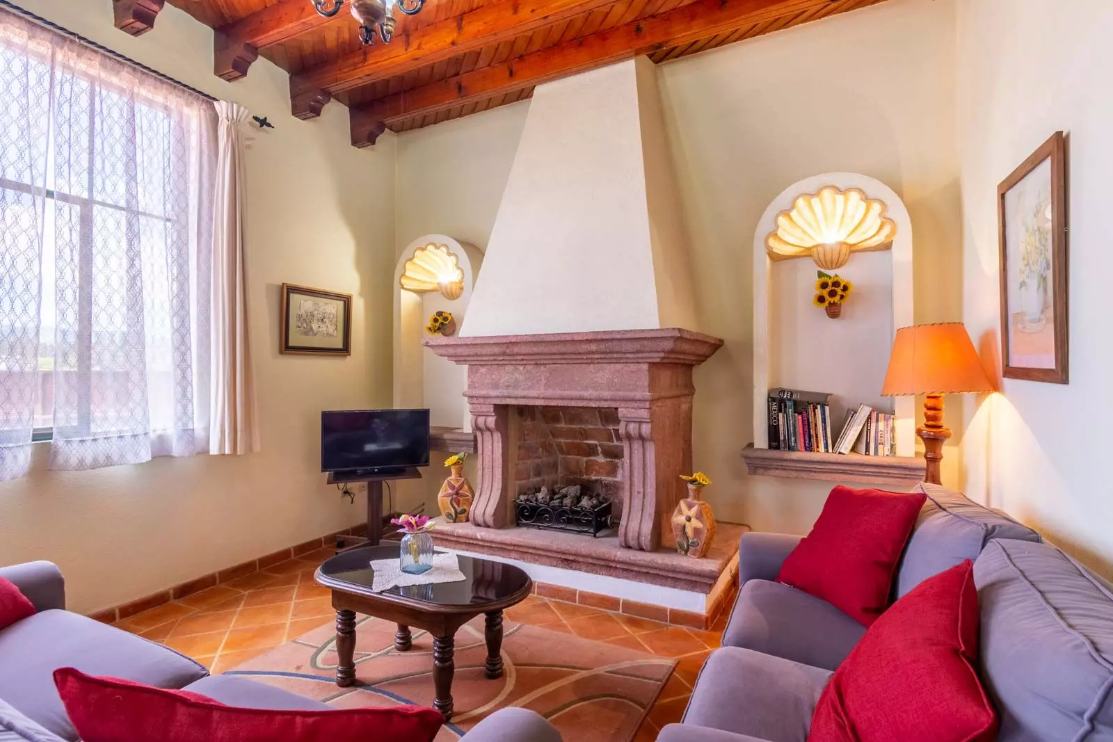 Agua Homes — Atascadero (Arcos de San Miguel), San Miguel de Allende — photo 19 — elegant living room, rustic charm, fireplace focal point