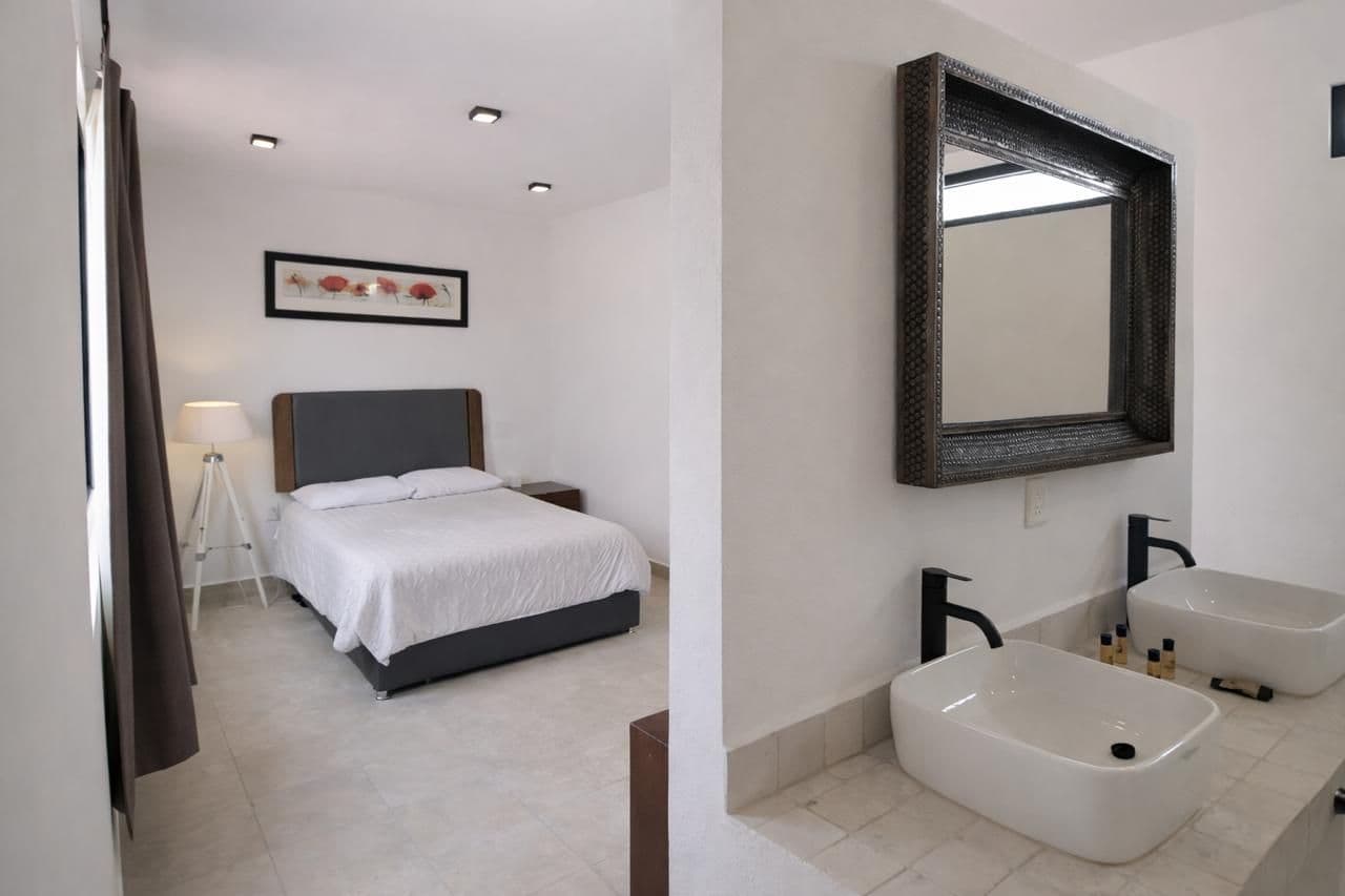 CASA DEL PUENTE DE UMARÁN — Centro, San Miguel de Allende — photo 11 — contemporary master suite with spa-inspired en-suite