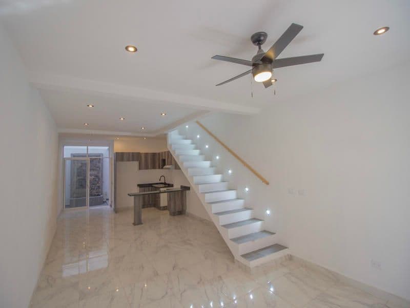 1952 Margarito Ledesma — San Miguel de Allende Centro, San Miguel de Allende — photo 12 — modern luxury foyer with sculptural staircase