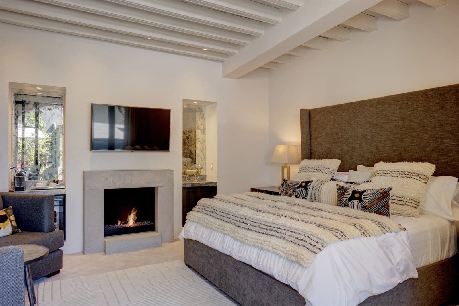 Casa Arcadia — Centro, San Miguel de Allende — photo 16 — luxurious master suite, fireplace warmth