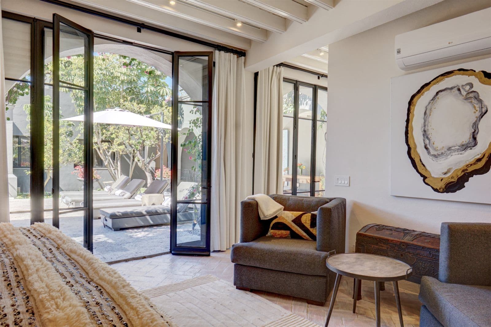 Casa Arcadia — Centro, San Miguel de Allende — photo 17 — luminous bedroom opens to serene courtyard